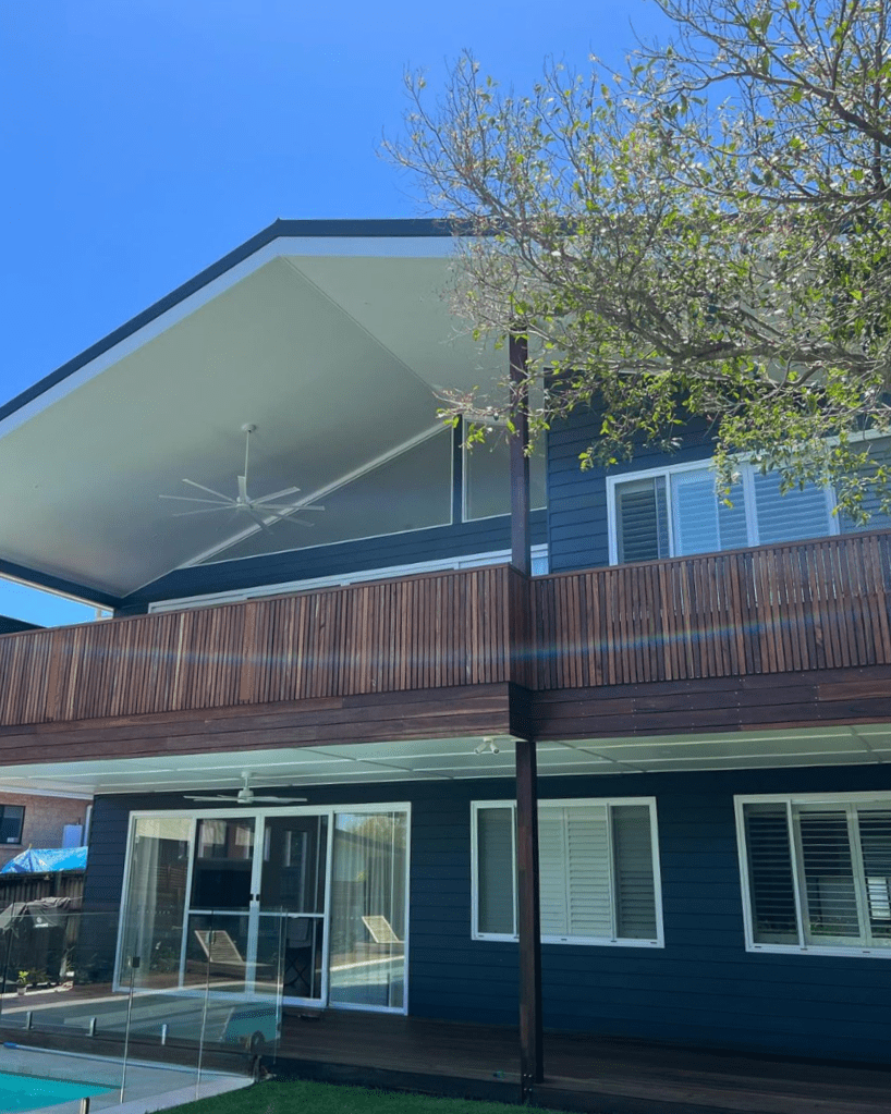 modern new build home painted navy blue