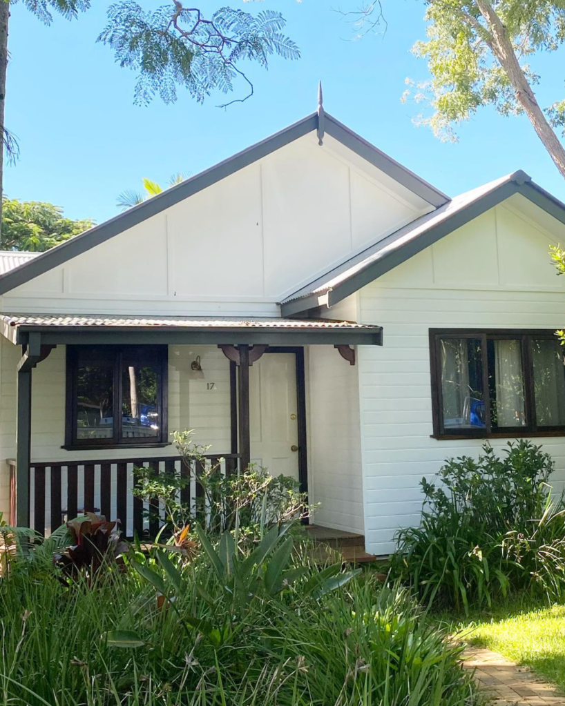 weatherboard white house with charcoal trimming