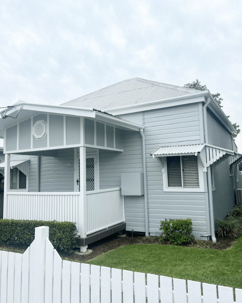 newly painted light blue weatherboard house